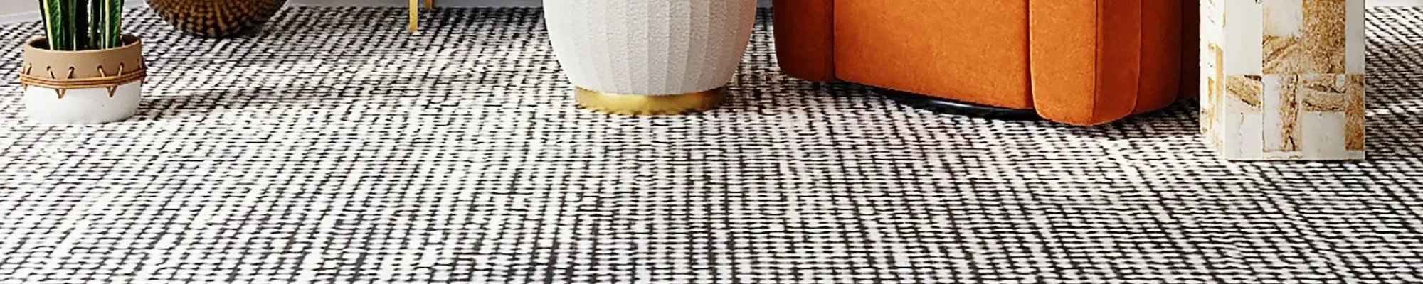 San Diego home with an area rug and orange arm chair