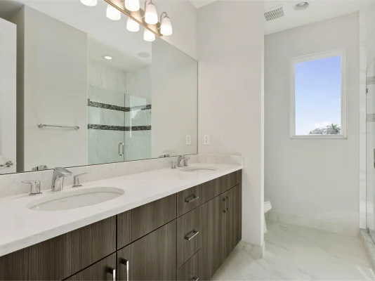 Marble look LVT flooring in a modern bathroom