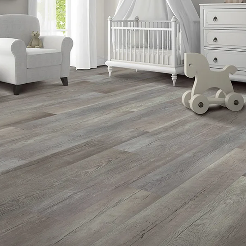 Grey LVP flooring in a nursery