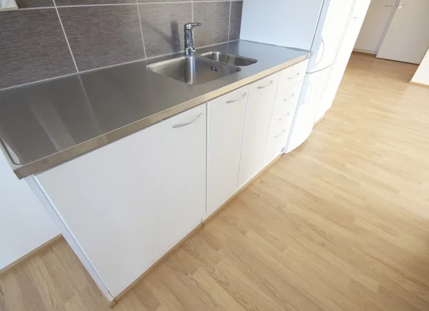 Waterproof wood look flooring in a compact kitchen