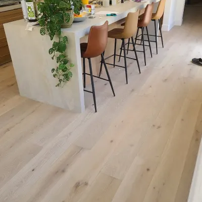 Hardwood flooring in a bright kitchen by Geneva Flooring
