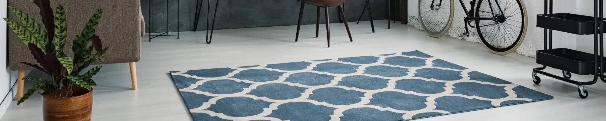 Home office with waterproof flooring and a blue area rug in San Diego, CA