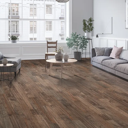 Apartment living room with rustic wood flooring by Geneva Flooring