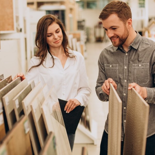 Customer and sales associate shopping for flooring in a San Diego showroom