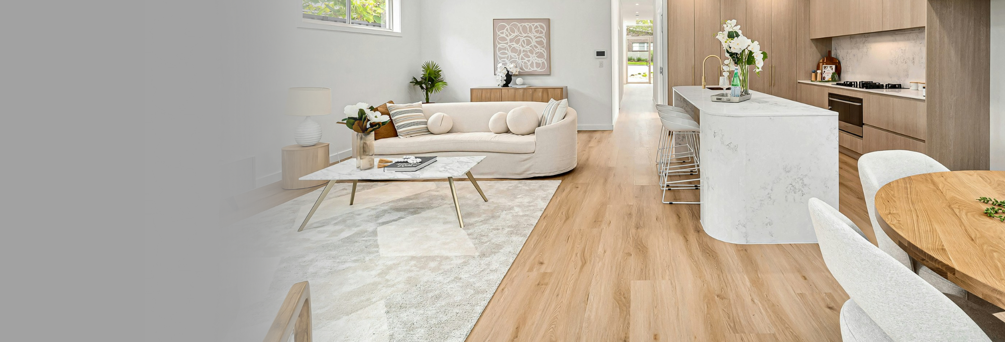 Modern kitchen with marble island and wood floors